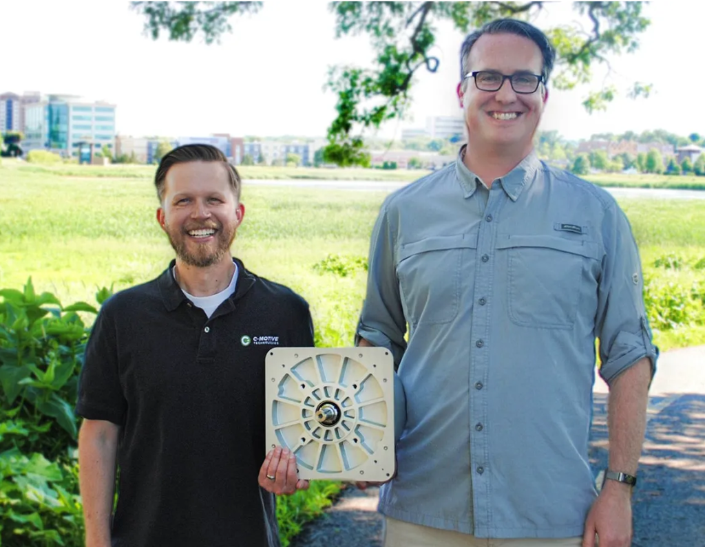 C-Motive's founders, Justin Reed [left] and Daniel Ludois, hold the company's prototype 360-watt electrostatic motor